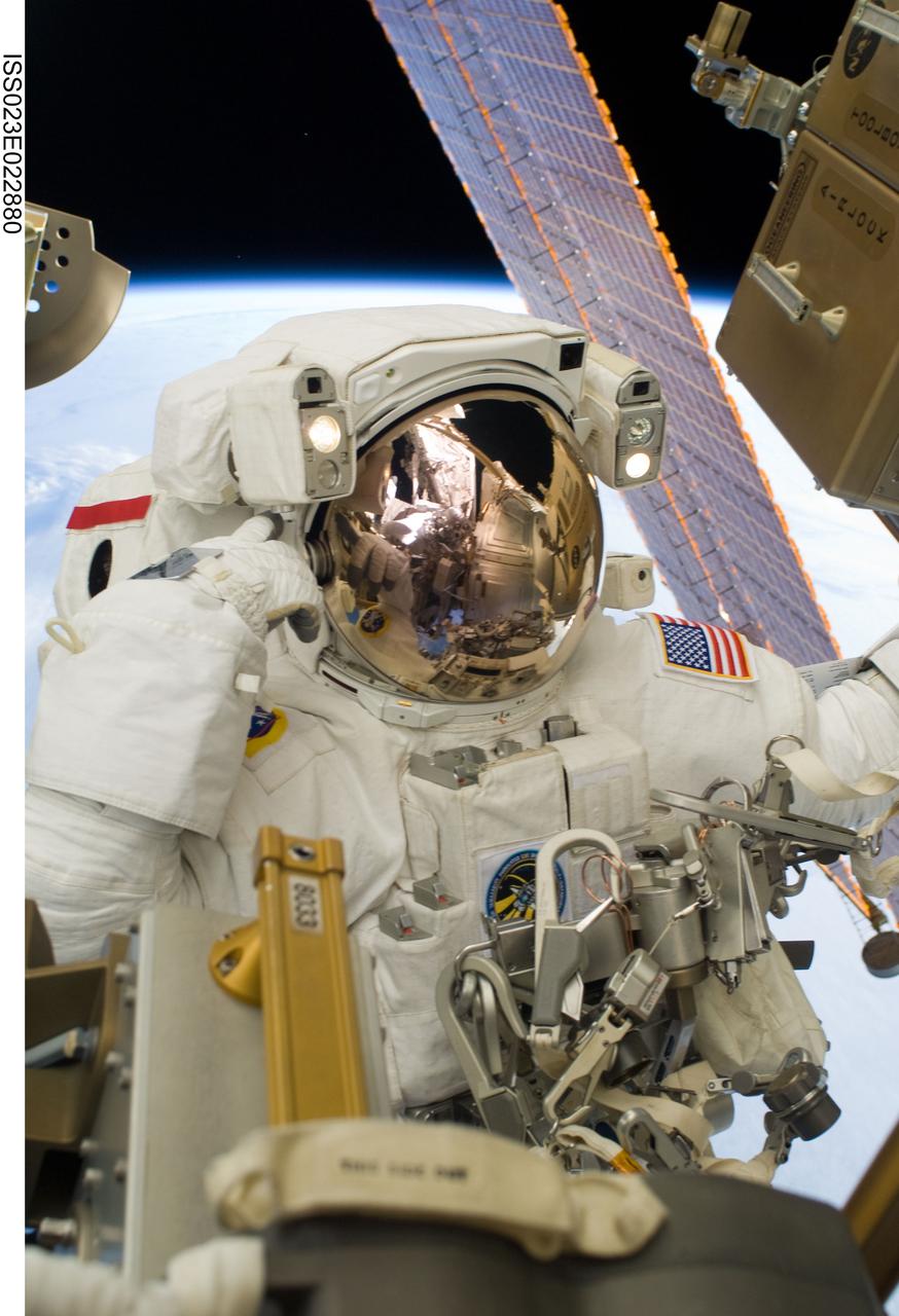 ISS023-E-022880 (13 April 2010) --- NASA astronaut Rick Mastracchio, STS-131 mission specialist, participates in the mission's third and final session of extravehicular activity (EVA) as construction and maintenance continue on the International Space Station. During the six-hour, 24-minute spacewalk, Mastracchio and astronaut Clayton Anderson (out of frame), mission specialist, hooked up fluid lines of the new 1,700-pound tank, retrieved some micrometeoroid shields from the Quest airlock’s exterior, relocated a portable foot restraint and prepared cables on the Zenith 1 truss for a spare Space to Ground Ku-Band antenna, two chores required before space shuttle Atlantis' STS-132/ULF-4 mission in May.