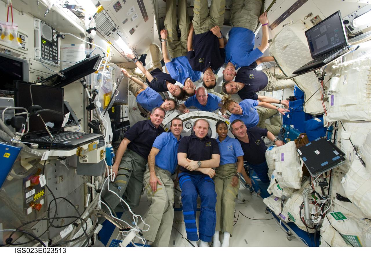 ISS023-E-023513 (14 April 2010) --- STS-131 and Expedition 23 crew members gather for a group portrait in the Kibo laboratory of the International Space Station while space shuttle Discovery remains docked with the station. STS-131 crew members pictured (light blue shirts) are NASA astronauts Alan Poindexter, commander; James P. Dutton Jr., pilot; Clayton Anderson, Rick Mastracchio, Dorothy Metcalf-Lindenburger, Stephanie Wilson and Japan Aerospace Exploration Agency astronaut Naoko Yamazaki, all mission specialists. Expedition 23 crew members pictured are Russian cosmonauts Oleg Kotov, commander; Mikhail Kornienko and Alexander Skvortsov; Japan Aerospace Exploration Agency astronaut Soichi Noguchi, and NASA astronauts T.J. Creamer and Tracy Caldwell Dyson, all flight engineers.