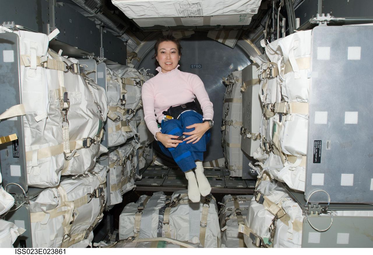ISS023-E-023861 (15 April 2010) --- Japan Aerospace Exploration Agency astronaut Naoko Yamazaki, STS-131 mission specialist, floats freely in the Leonardo Multi-purpose Logistics Module (MPLM) linked to the International Space Station while space shuttle Discovery remains docked with the station.