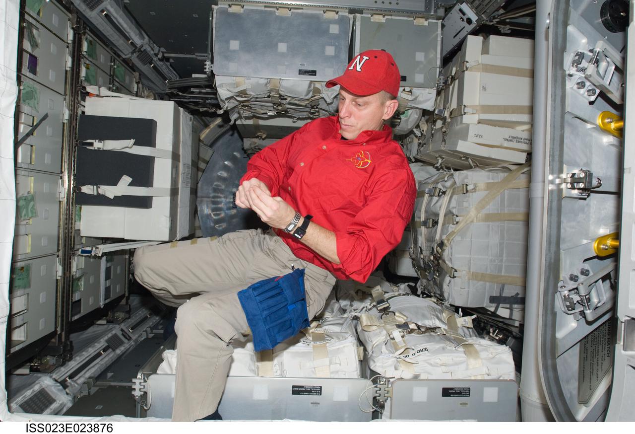 ISS023-E-023876 (15 April 2010) --- NASA astronaut Clayton Anderson, STS-131 mission specialist, works in the Leonardo Multi-purpose Logistics Module (MPLM) linked to the International Space Station while space shuttle Discovery remains docked with the station.