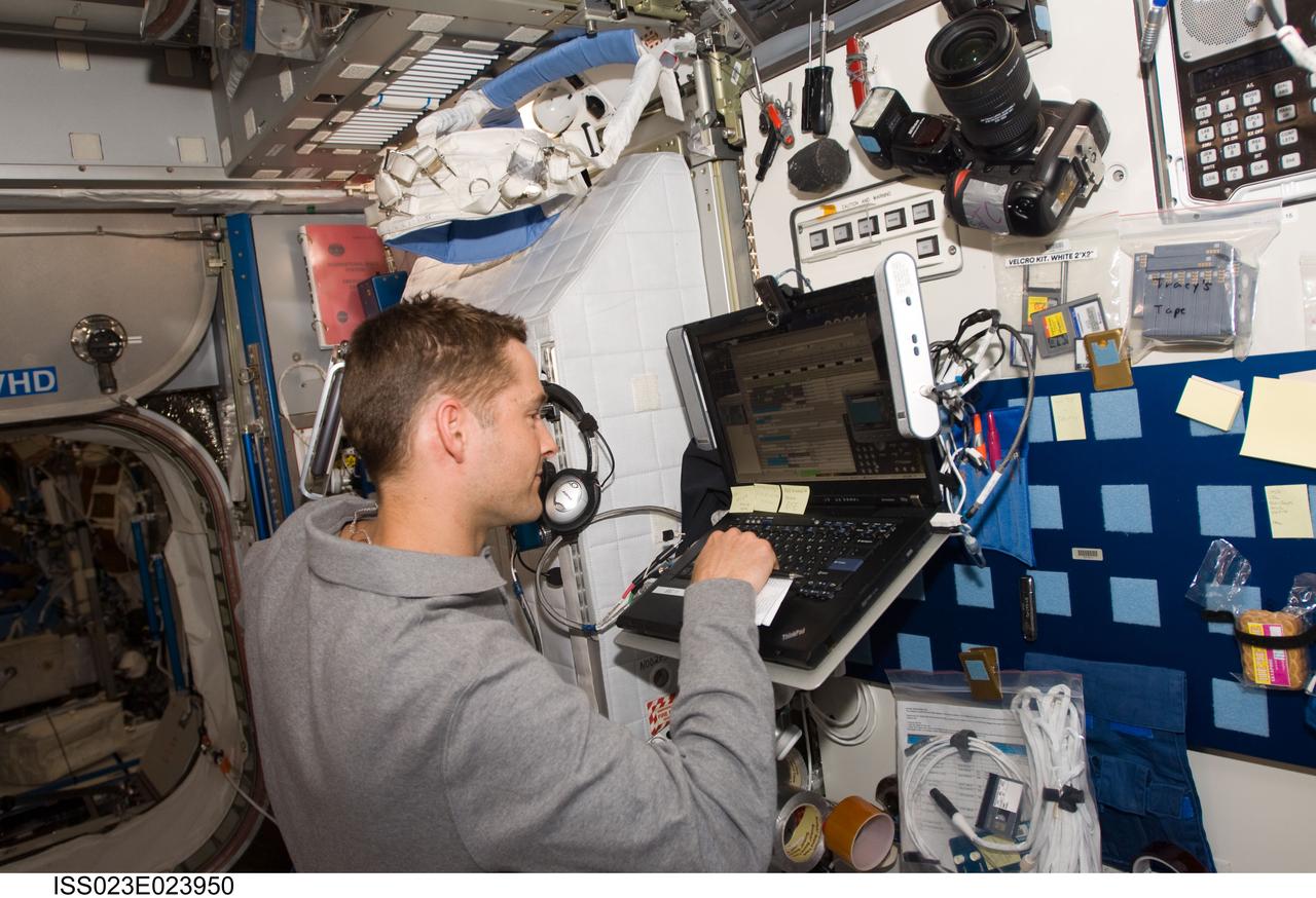 ISS023-E-023950 (15 April 2010) --- NASA astronaut James P. Dutton Jr., STS-131 pilot, uses a computer in the Harmony node of the International Space Station while space shuttle Discovery remains docked with the station.