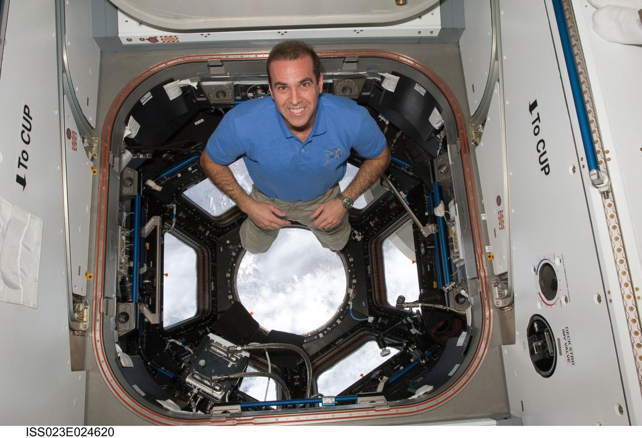 ISS023-E-024620 (17 April 2010) --- NASA astronaut Rick Mastracchio, STS-131 mission specialist, poses for a photo in the Cupola of the International Space Station while space shuttle Discovery remains docked with the station.