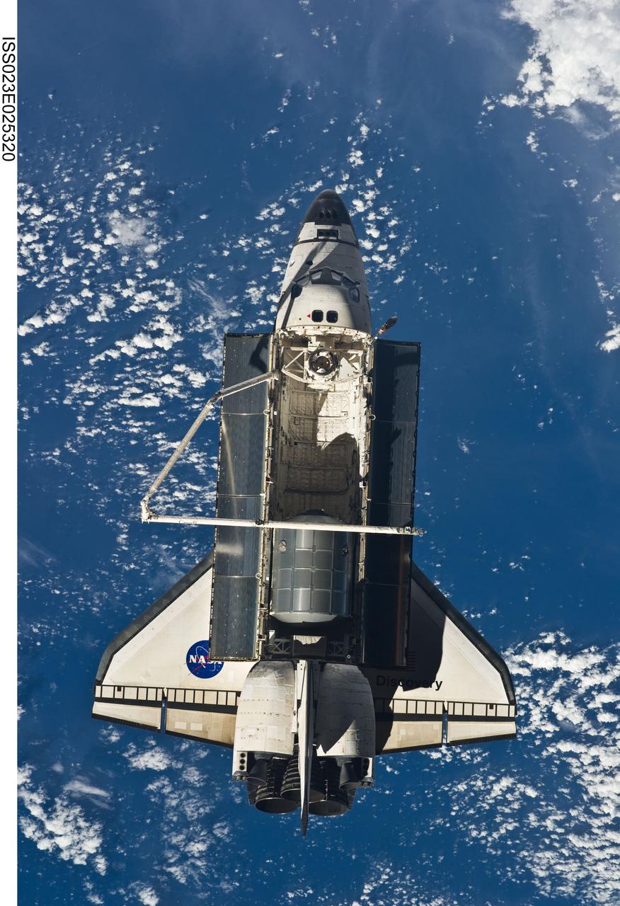 ISS023-E-025320 (17 April 2010) --- Space shuttle Discovery is featured in this image photographed by an Expedition 23 crew member on the International Space Station soon after the shuttle and station began their post-undocking relative separation. Undocking of the two spacecraft occurred at 7:52 a.m. (CDT) on April 17, 2010, ending a stay of 10 days, 5 hours and 8 minutes. The visit included three spacewalks and delivery of more than seven tons of equipment and supplies. A blue and white part of Earth provides the backdrop for the scene.