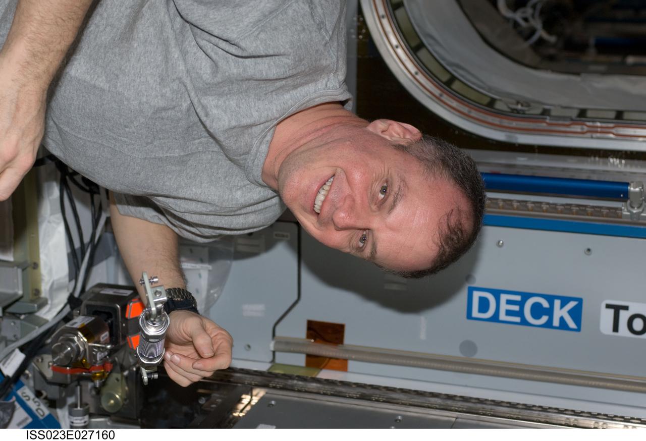 ISS023-E-027160 (24 April 2010) --- NASA astronaut T.J. Creamer, Expedition 23 flight engineer, prepares the Combined Operational Load Bearing External Resistance Treadmill (COLBERT) for relocation from the Harmony node to its final place in the Tranquility node of the International Space Station.