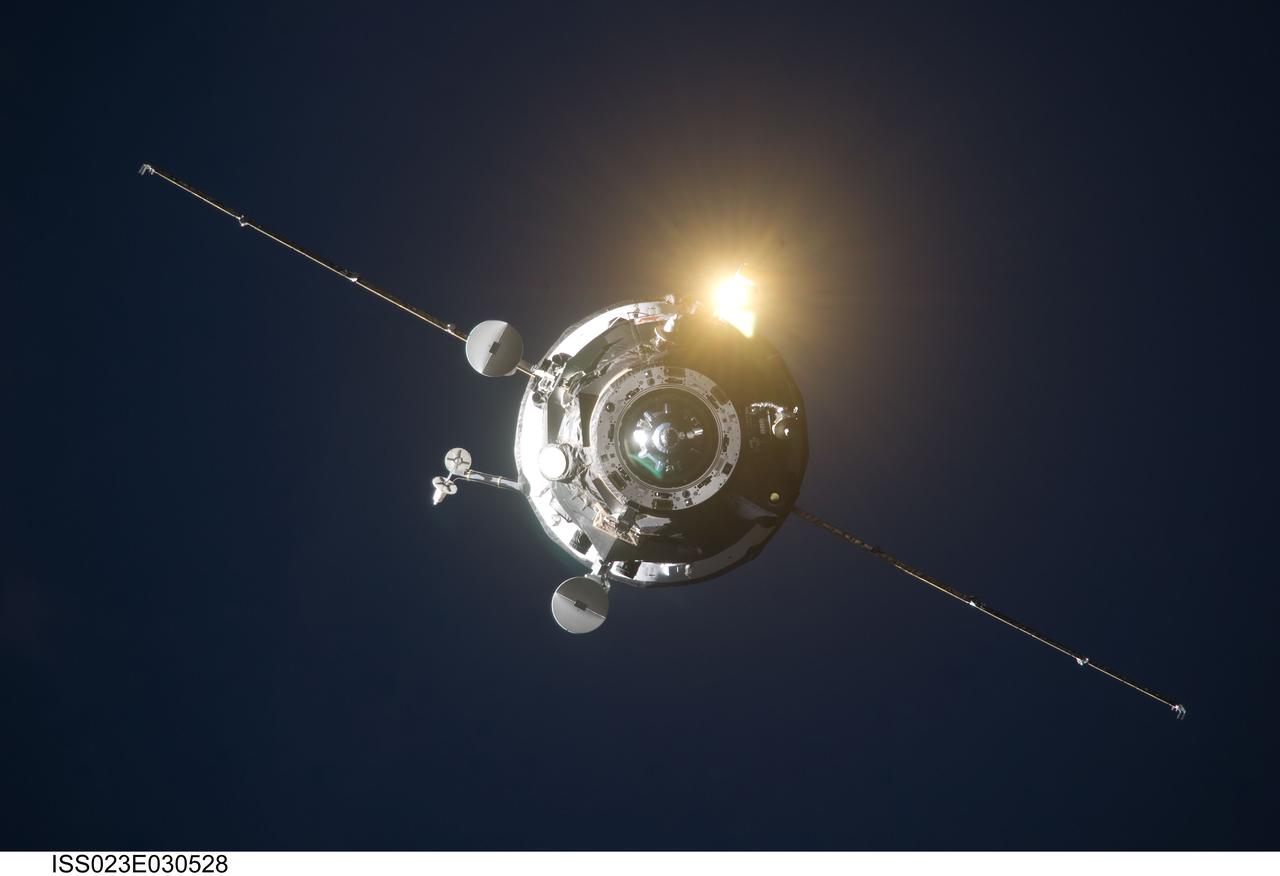 ISS023-E-030528 (1 May 2010) --- An unpiloted ISS Progress resupply vehicle approaches the International Space Station, bringing 2.6 tons of food, fuel, oxygen, propellant and supplies for the Expedition 23 crew members aboard the station. Progress 37 docked to the Pirs Docking Compartment at 2:30 p.m. (EDT) on May 1, 2010, after a three-day flight from the Baikonur Cosmodrome in Kazakhstan. The docking was conducted by Russian cosmonaut Oleg Kotov, commander, in manual control through the TORU (telerobotically operated) rendezvous system due to a jet failure on the Progress that forced a shutdown of the Kurs automated rendezvous system.