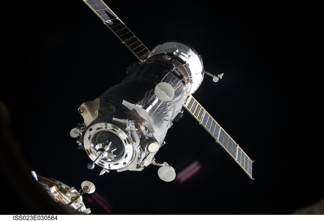 ISS023-E-030584 (1 May 2010) --- An unpiloted ISS Progress resupply vehicle approaches the International Space Station, bringing 2.6 tons of food, fuel, oxygen, propellant and supplies for the Expedition 23 crew members aboard the station. Progress 37 docked to the Pirs Docking Compartment at 2:30 p.m. (EDT) on May 1, 2010, after a three-day flight from the Baikonur Cosmodrome in Kazakhstan. The docking was conducted by Russian cosmonaut Oleg Kotov, commander, in manual control through the TORU (telerobotically operated) rendezvous system due to a jet failure on the Progress that forced a shutdown of the Kurs automated rendezvous system.