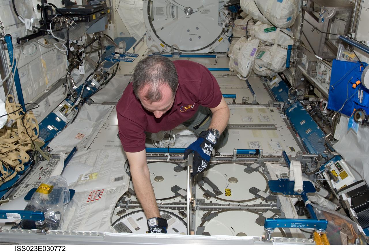 ISS023-E-030772 (2 May 2010) --- NASA astronaut T.J. Creamer, Expedition 23 flight engineer, services the Minus Eighty Laboratory Freezer for ISS (MELFI-1) in the Kibo laboratory of the International Space Station.