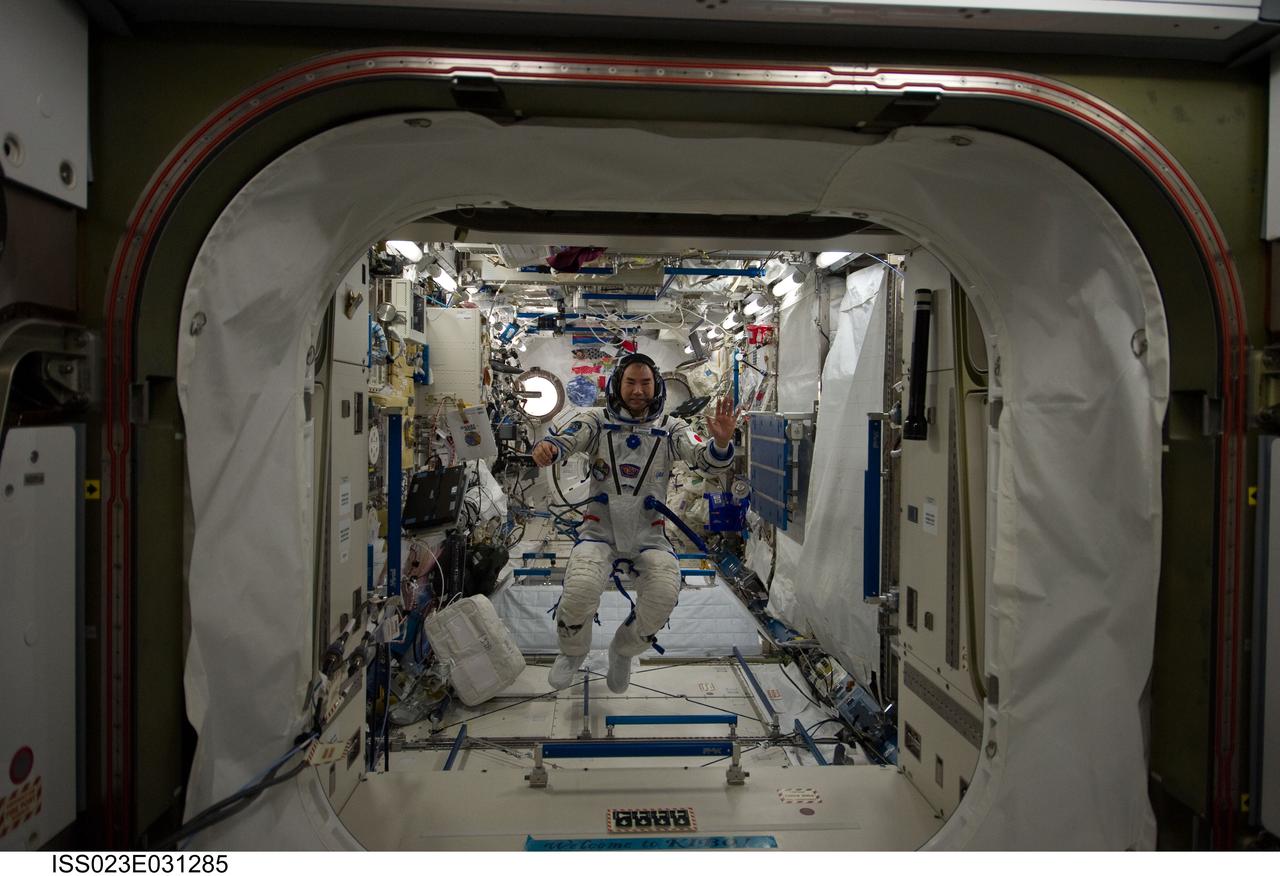 ISS023-E-031285 (3 May 2010) --- Japan Aerospace Exploration Agency (JAXA) astronaut Soichi Noguchi, Expedition 23 flight engineer, wearing his Russian Sokol launch and entry suit, is pictured floating freely in the Kibo laboratory of the International Space Station.