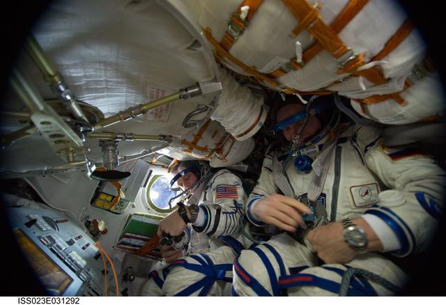 NASA image: Crewmembers in Soyuz TMA-17/21S during Sokol Suit Leak Check