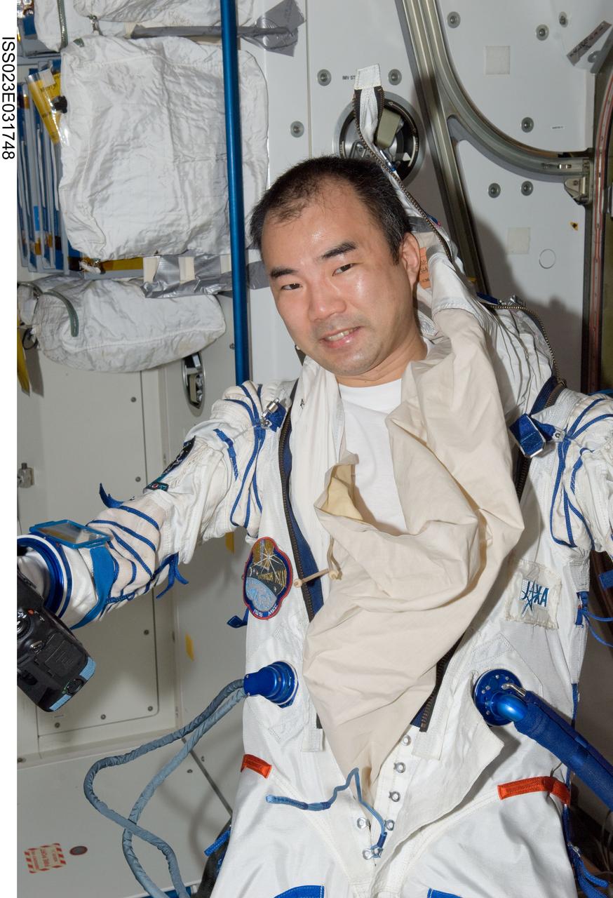 ISS023-E-031748 (3 May 2010) --- Japan Aerospace Exploration Agency (JAXA) astronaut Soichi Noguchi, Expedition 23 flight engineer, attired in his Russian Sokol launch and entry suit, is pictured in the Unity node of the International Space Station.