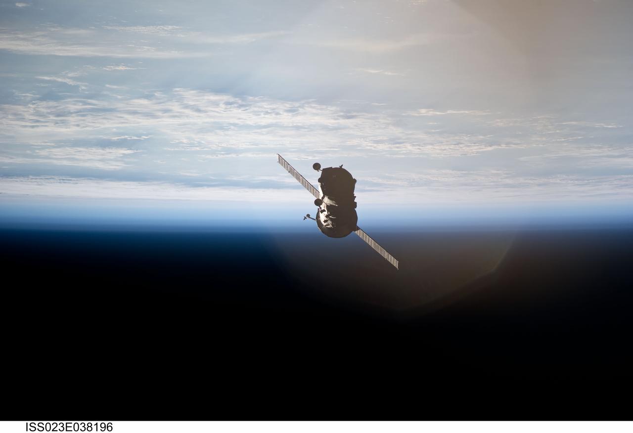 ISS023-E-038196 (10 May 2010) --- The unpiloted ISS Progress 36 resupply vehicle departs from the International Space Station?s Zvezda Service Module?s aft port on May 10, 2010. Filled with trash and discarded items, the Progress will be used for scientific experiments until it is deorbited and burned up in Earth?s atmosphere.