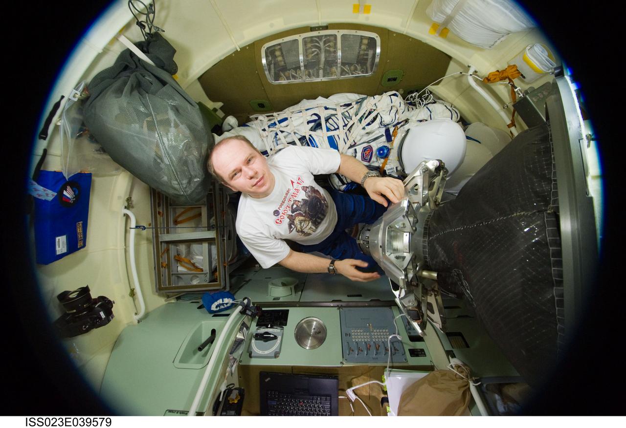 ISS023-E-039579 (12 May 2010) --- Russian cosmonaut Oleg Kotov, Expedition 23 commander, is pictured in the Soyuz 21 (TMA-17) spacecraft during preparations for its relocation from the Zarya nadir port to the Zvezda Service Module's aft port on May 12, 2010. A fish-eye lens attached to an electronic still camera was used to capture this image.