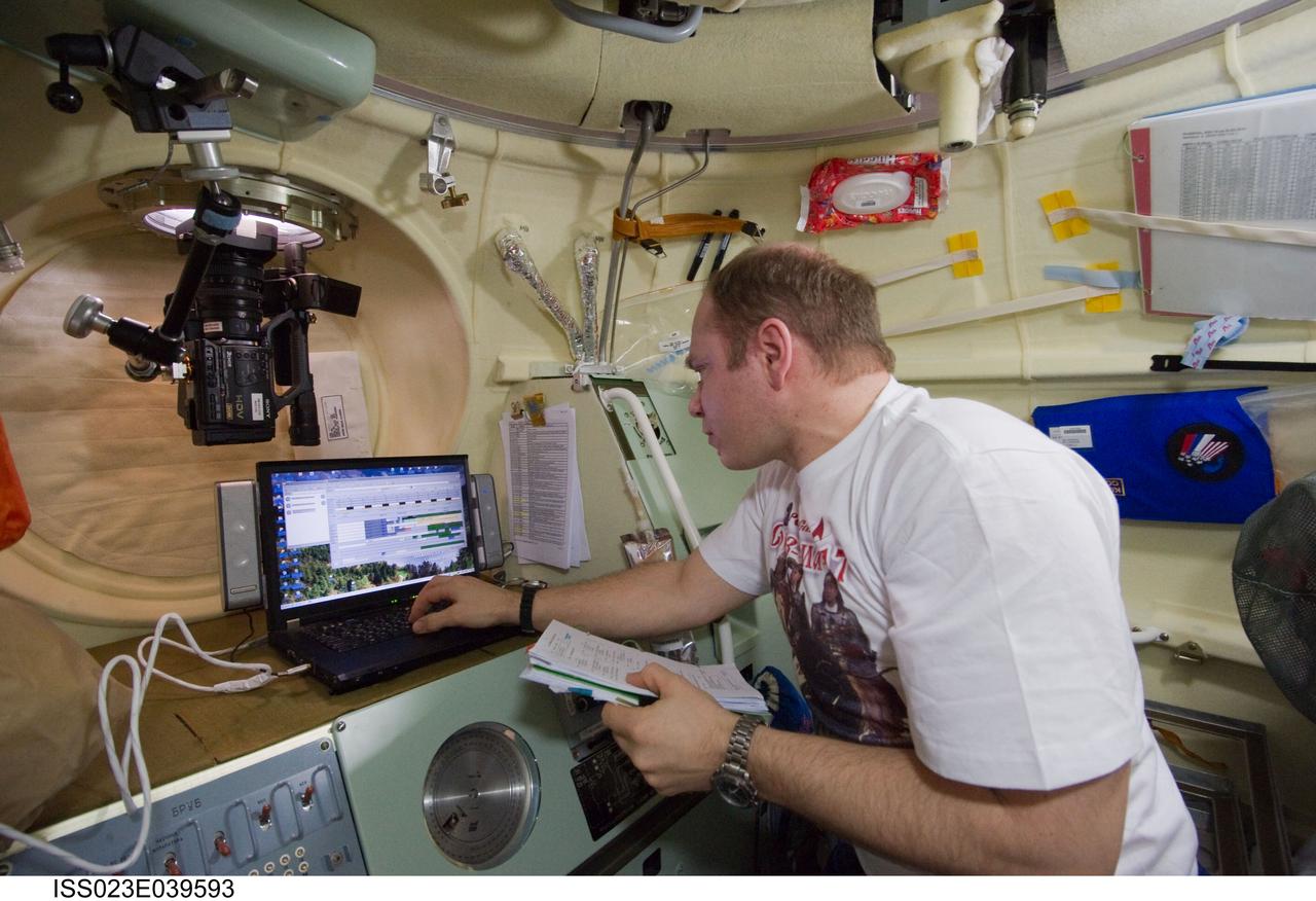 ISS023-E-039593 (12 May 2010) --- Russian cosmonaut Oleg Kotov, Expedition 23 commander, uses a computer in the Soyuz 21 (TMA-17) spacecraft during preparations for its relocation from the Zarya nadir port to the Zvezda Service Module's aft port on May 12, 2010.