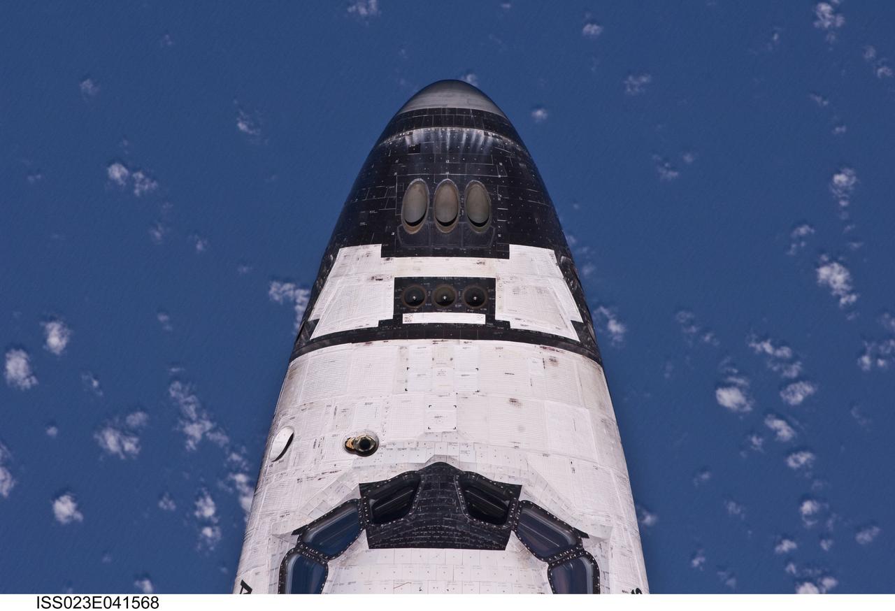 ISS023-E-041568 (16 May 2010) --- This view of the nose of the space shuttle Atlantis was provided by an Expedition 23 crew member during a survey of the approaching STS-132 vehicle prior to docking with the International Space Station. As part of the survey and part of every mission's activities, Atlantis performed a back-flip for the rendezvous pitch maneuver (RPM). The image was photographed with a digital still camera, using a 400mm lens at a distance of about 600 feet (180 meters).
