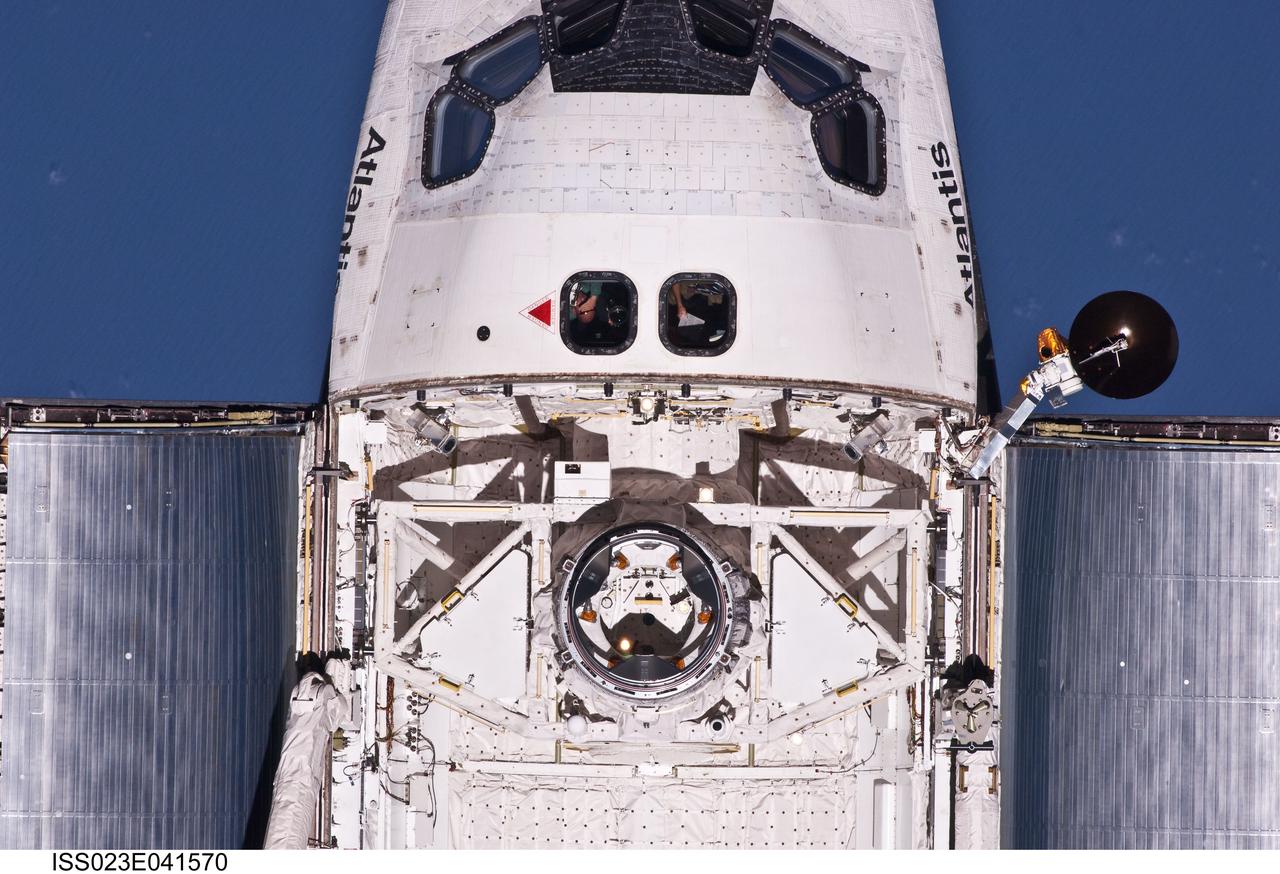 ISS023-E-041570 (16 May 2010) --- This view of crew cabin and forward payload bay of the space shuttle Atlantis was provided by an Expedition 23 crew member during a survey of the approaching STS-132 vehicle prior to docking with the International Space Station. As part of the survey and part of every mission's activities, Atlantis performed a back-flip for the rendezvous pitch maneuver (RPM). The image was photographed with a digital still camera, using a 400mm lens at a distance of about 600 feet (180 meters).