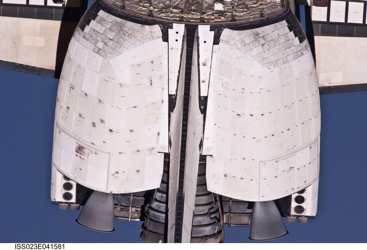 ISS023-E-041581 (16 May 2010) --- This close-up view of the vertical stabilizer and orbital maneuvering system (OMS) pods of the space shuttle Atlantis was provided by an Expedition 23 crew member during a survey of the approaching STS-132 vehicle prior to docking with the International Space Station. As part of the survey and part of every mission's activities, Atlantis performed a back-flip for the rendezvous pitch maneuver (RPM). The image was photographed with a digital still camera, using a 400mm lens at a distance of about 600 feet (180 meters).