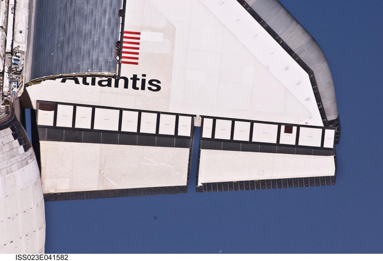 ISS023-E-041582 (16 May 2010) --- This partial view of the starboard wing of the space shuttle Atlantis was provided by an Expedition 23 crew member during a survey of the approaching STS-132 vehicle prior to docking with the International Space Station. As part of the survey and part of every mission's activities, Atlantis performed a back-flip for the rendezvous pitch maneuver (RPM). The image was photographed with a digital still camera, using a 400mm lens at a distance of about 600 feet (180 meters).