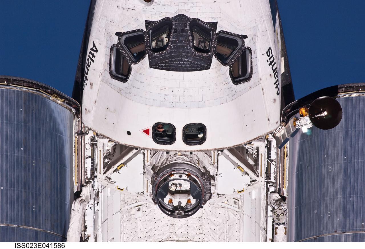 ISS023-E-041586 (16 May 2010) --- This view of crew cabin and forward payload bay of the space shuttle Atlantis was provided by an Expedition 23 crew member during a survey of the approaching STS-132 vehicle prior to docking with the International Space Station. As part of the survey and part of every mission's activities, Atlantis performed a back-flip for the rendezvous pitch maneuver (RPM). The image was photographed with a digital still camera, using a 400mm lens at a distance of about 600 feet (180 meters).