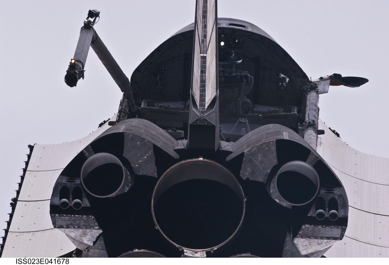 ISS023-E-041678 (16 May 2010) --- This view of the aft portion of the space shuttle Atlantis, including main engines, part of the cargo bay, vertical stabilizer and orbital maneuvering system (OMS) pods was provided by an Expedition 23 crew member during a survey of the approaching STS-132 vehicle prior to docking with the International Space Station. As part of the survey and part of every mission's activities, Atlantis performed a back-flip for the rendezvous pitch maneuver (RPM). The image was photographed with a digital still camera, using a 400mm lens at a distance of about 600 feet (180 meters).