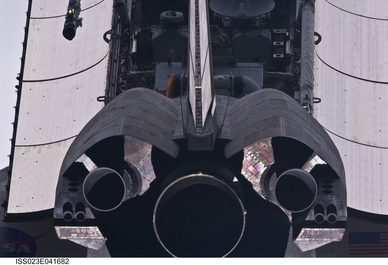ISS023-E-041682 (16 May 2010) --- This view of the aft portion of the space shuttle Atlantis, including main engines, part of the cargo bay, vertical stabilizer and orbital maneuvering system (OMS) pods was provided by an Expedition 23 crew member during a survey of the approaching STS-132 vehicle prior to docking with the International Space Station. As part of the survey and part of every mission's activities, Atlantis performed a back-flip for the rendezvous pitch maneuver (RPM). The image was photographed with a digital still camera, using a 400mm lens at a distance of about 600 feet (180 meters).