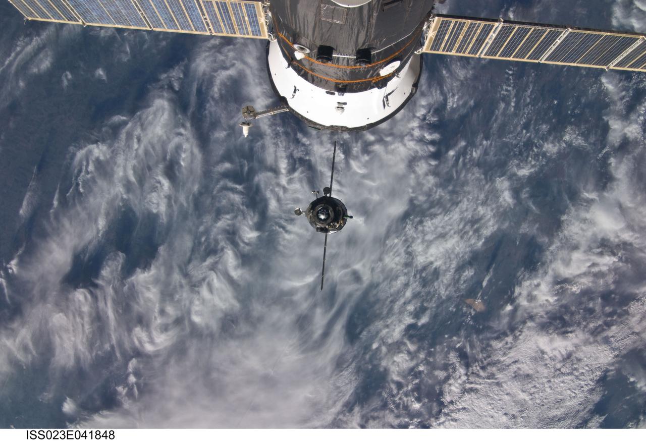 ISS023-E-041848 (12 May 2010) --- The Soyuz TMA-17 spacecraft is featured in this image photographed by an Expedition 23 crew member on the International Space Station during the relocation of the Soyuz from the Zarya nadir port to the Zvezda Service Module aft port, freeing up Zarya?s nadir port for the installation of the Rassvet Mini-Research Module 1 (MRM1) during the upcoming STS-132/ULF-4 mission. Russian cosmonaut Oleg Kotov, Soyuz and Expedition 23 commander; along with NASA astronaut T.J. Creamer and Japan Aerospace Exploration Agency (JAXA) astronaut Soichi Noguchi, both flight engineers, undocked the Soyuz spacecraft at 8:26 a.m. (CDT) and docked it to Zvezda at 8:53 a.m. on May 12, 2010. Another Russian spacecraft, currently docked with the station, is visible at top.