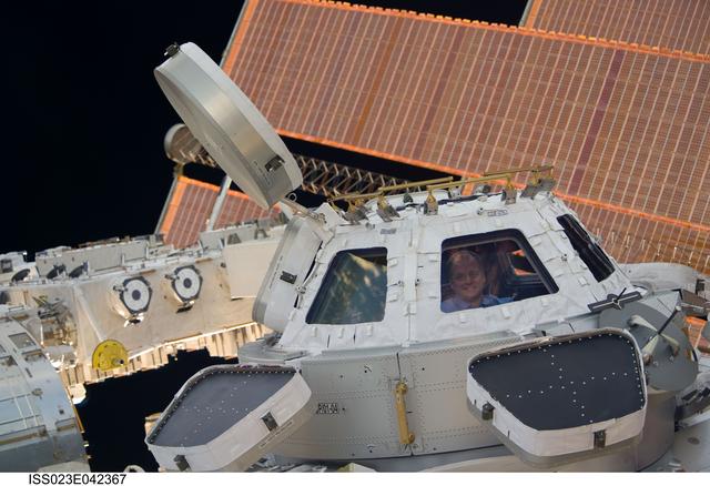 NASA image: View of Creamer in a Cupola Window