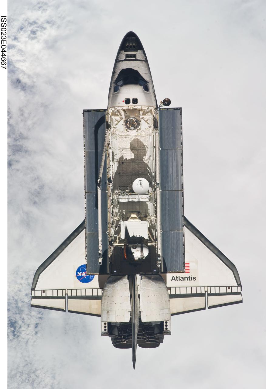 ISS023-E-044667 (16 May 2010) --- Backdropped by a blanket of clouds, space shuttle Atlantis is featured in this image photographed by an Expedition 23 crew member as the shuttle approaches the International Space Station during STS-132 rendezvous and docking operations. Docking occurred at 9:28 a.m. (CDT) on May 16, 2010.