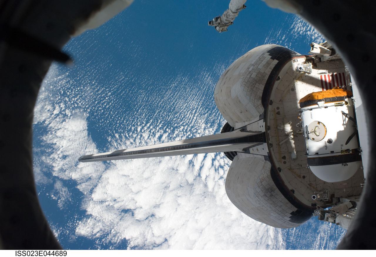 ISS023-E-044689 (16 May 2010) --- Pictured from a window on the International Space Station, the aft section of the docked space shuttle Atlantis (STS-132) is featured in this image photographed by an Expedition 23 crew member on the station.