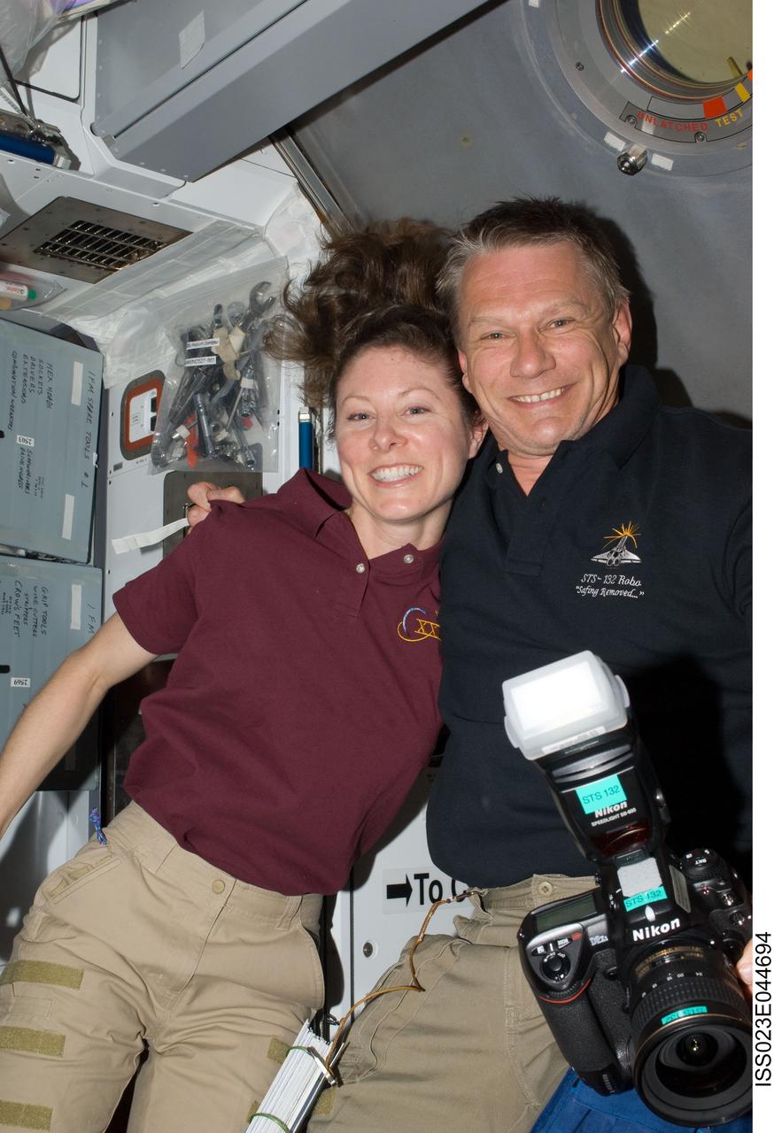 ISS023-E-044694 (16 May 2010) --- Soon after initial hatch opening, NASA astronauts Tracy Caldwell Dyson, Expedition 23 flight engineer; and Piers Sellers, STS-132 mission specialist, pose for a photo in the Harmony node of the International Space Station.