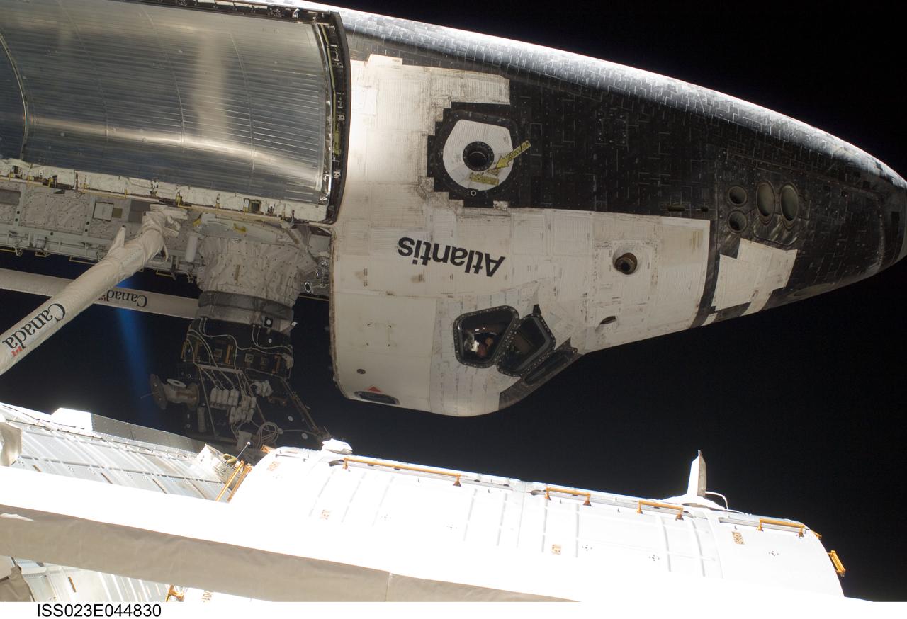 ISS023-E-044830 (17 May 2010) --- This image features space shuttle Atlantis's cabin and forward cargo bay while the STS-132 spacecraft was docked to the International Space Station during flight day four's extravehicular activity of astronauts Garrett Reisman and Steve Bowen (both out of frame). Though three sessions of extravehicular activity (EVA) will involve only three astronauts (two on each occasion) who actually leave the shirt-sleeve environments of the two docked spacecraft, all twelve astronauts and cosmonauts on the two combined crews have roles in supporting the EVA work. Photo credit: NASA or National Aeronautics and Space Administration