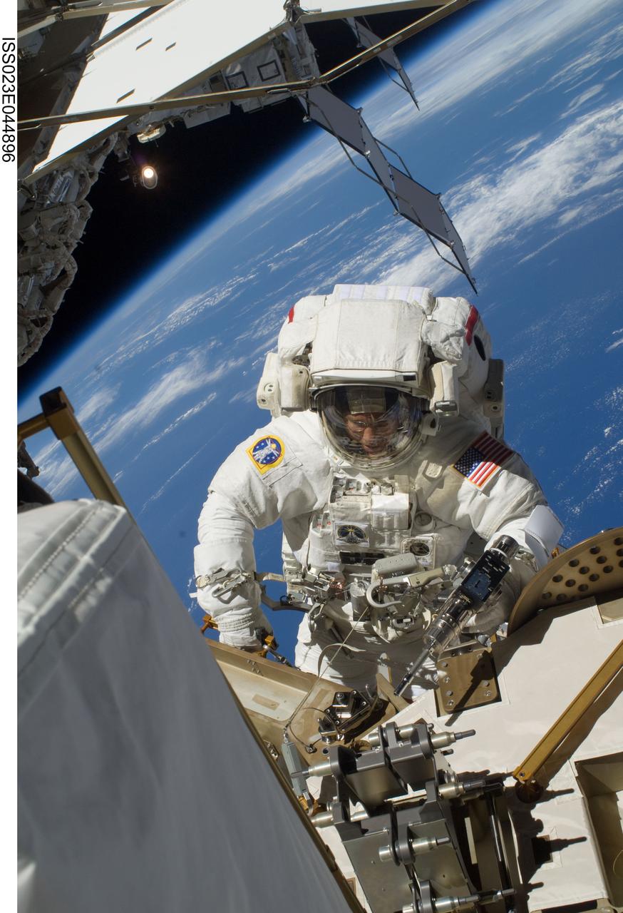ISS023-E-044896 (17 May 2010) --- NASA astronaut Steve Bowen, STS-132 mission specialist, participates in the mission's first session of extravehicular activity (EVA) as construction and maintenance continue on the International Space Station. During the seven-hour, 25-minute spacewalk, Bowen and NASA astronaut Garrett Reisman (out of frame), mission specialist, loosened bolts holding six replacement batteries, installed a second antenna for high-speed Ku-band transmissions and adding a spare parts platform to Dextre, a two-armed extension for the station?s robotic arm.