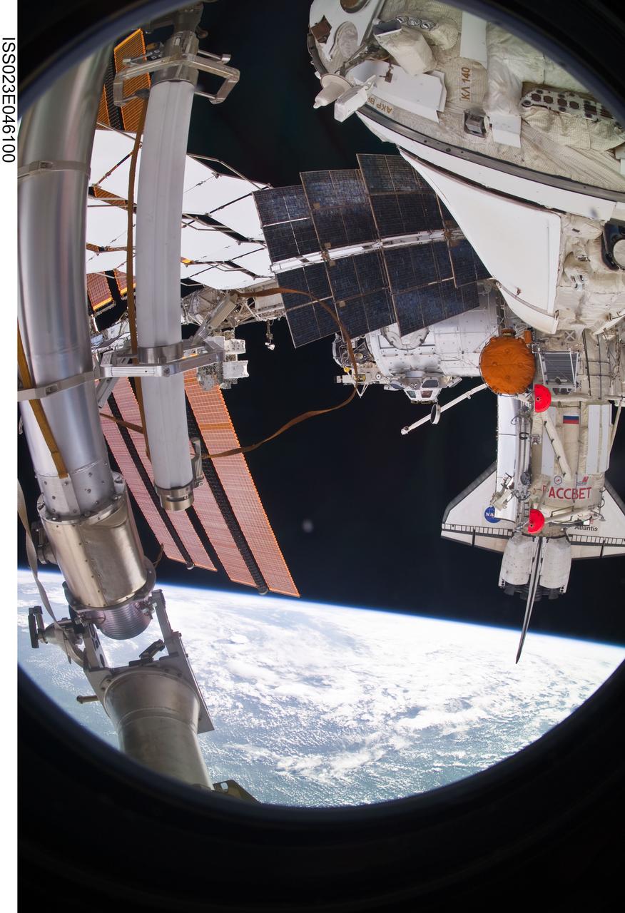 ISS023-E-046100 (18 May 2010) --- Rassvet (Russian for "dawn"), also known as the Mini-Research Module 1 (MRM1), was photographed by one of twelve astronauts and cosmonauts onboard the International Space Station following its deployment. Rassvet will be primarily used for cargo storage and as a docking port for visiting spacecraft. It flew to the ISS along with the STS-132 astronauts   aboard space shuttle Atlantis (seen docked to the orbital outpost among this cluster of hardware) over the mid-May 2010 weekend. Cupola, a recent addition to the ISS, because of its distance from the camera, shows up as a tiny gray object at photo center.