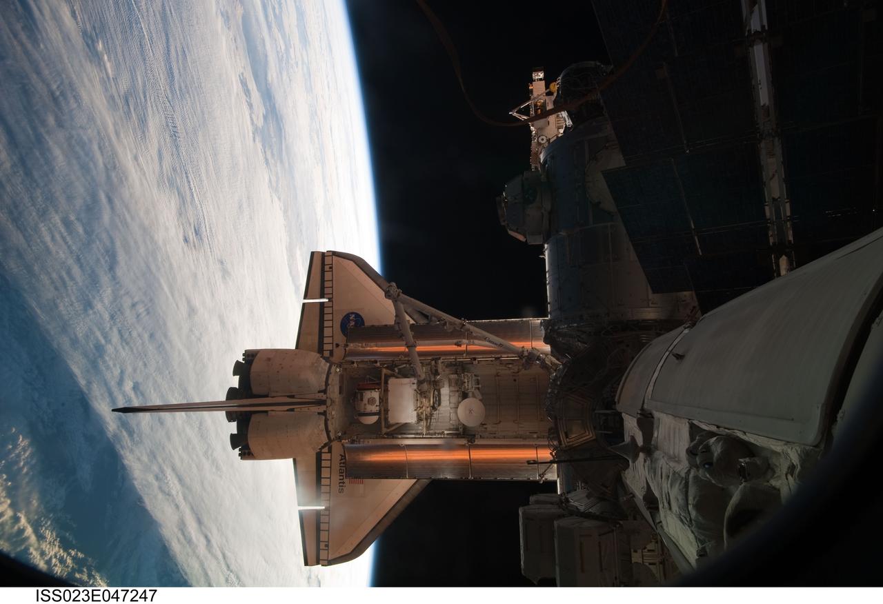 ISS023-E-047247 (16 May 2010) --- Space shuttle Atlantis is featured in this image photographed by an Expedition 23 crew member shortly after Atlantis docked with the International Space Station. The Russian-built Mini-Research Module 1 (MRM-1), named Rassvet, is visible in the cargo bay. Earth?s horizon and the blackness of space provide the backdrop for the scene.