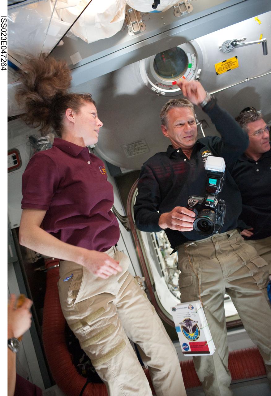 ISS023-E-047264 (16 May 2010) --- NASA astronauts Tracy Caldwell Dyson, Expedition 23 flight engineer; Piers Sellers (center) and Steve Bowen, both STS-132 mission specialists, are pictured in the Harmony node of the International Space Station soon after space shuttle Atlantis docked with the station.