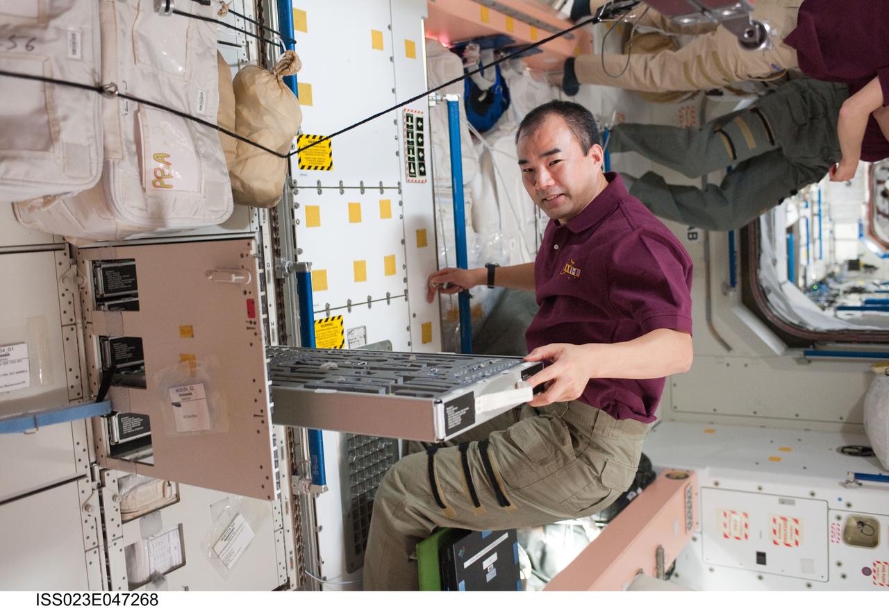 ISS023-E-047268 (16 May 2010) --- Japan Aerospace Exploration Agency (JAXA) astronaut Soichi Noguchi, Expedition 23 flight engineer, works in the Unity node of the International Space Station while space shuttle Atlantis remains docked with the station.