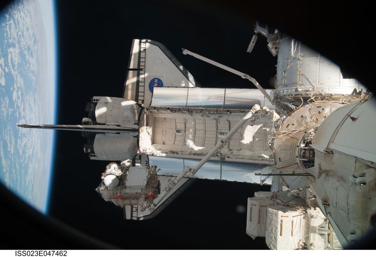 ISS023-E-047462 (18 May 2010) --- In the grasp of the station?s robotic Canadarm2, the Russian-built Mini-Research Module 1 (MRM-1) is moved to be permanently attached to the Earth-facing port of the Zarya Functional Cargo Block (FGB) of the International Space Station. Named Rassvet, Russian for "dawn," the module is the second in a series of new pressurized components for Russia. Rassvet will be used for cargo storage and will provide an additional docking port to the station.