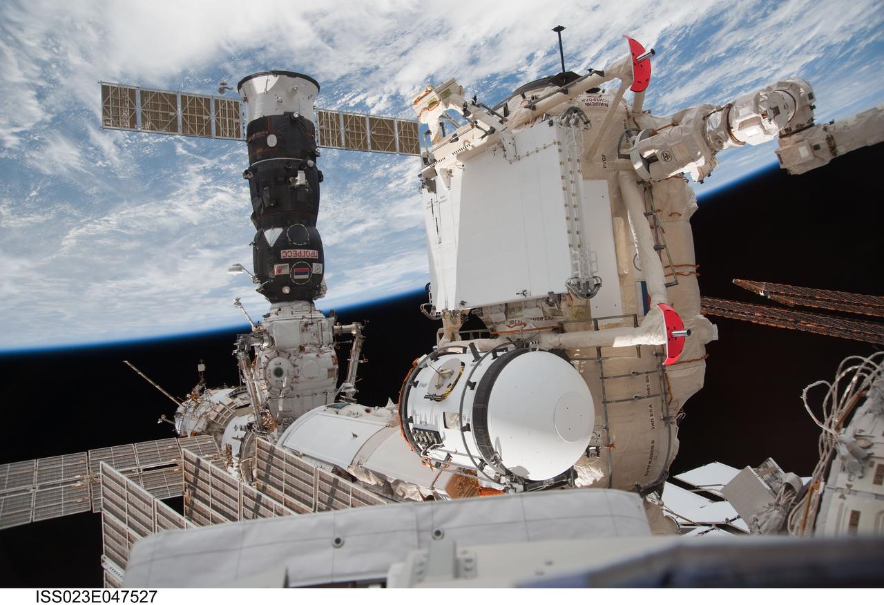 ISS023-E-047527 (18 May 2010) --- In the grasp of the station?s robotic Canadarm2, the Russian-built Mini-Research Module 1 (MRM-1) is attached to the Earth-facing port of the Zarya Functional Cargo Block (FGB) of the International Space Station. Named Rassvet, Russian for "dawn," the module is the second in a series of new pressurized components for Russia. Rassvet will be used for cargo storage and will provide an additional docking port to the station.