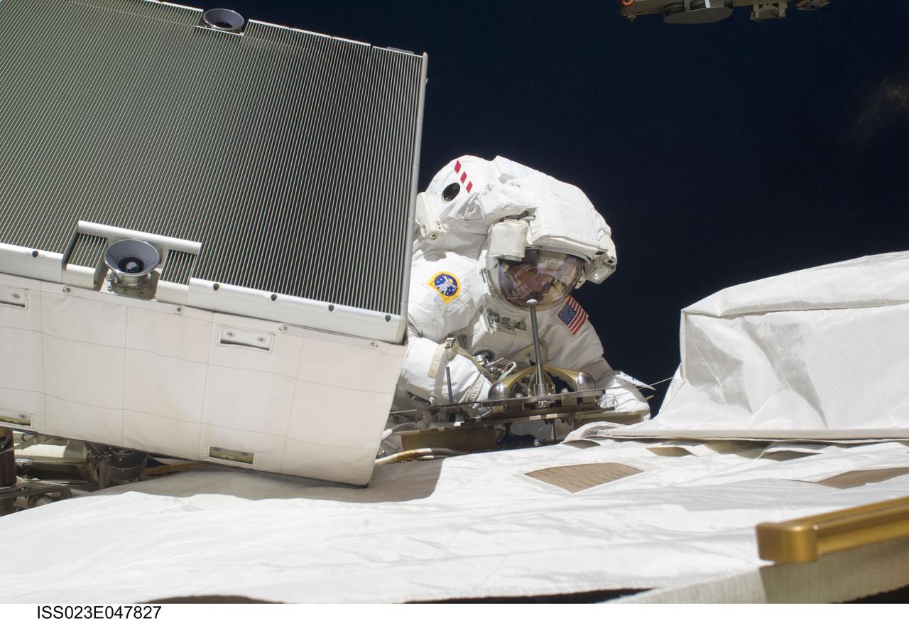 ISS023-E-047827 (21 May 2010) --- NASA astronaut Michael Good, STS-132 mission specialist, participates in the mission?s third and final session of extravehicular activity (EVA) as construction and maintenance continue on the International Space Station. During the six-hour, 46-minute spacewalk, Good and NASA astronaut Garrett Reisman (out of frame), mission specialist, completed the installation of the final two of the six new batteries for the B side of the port 6 solar array. In addition, the astronauts installed a backup ammonia jumper cable between the port 4 and 5 trusses of the station, transferred a Power and Data Grapple Fixture from the shuttle to the station, and reconfigured some tools.