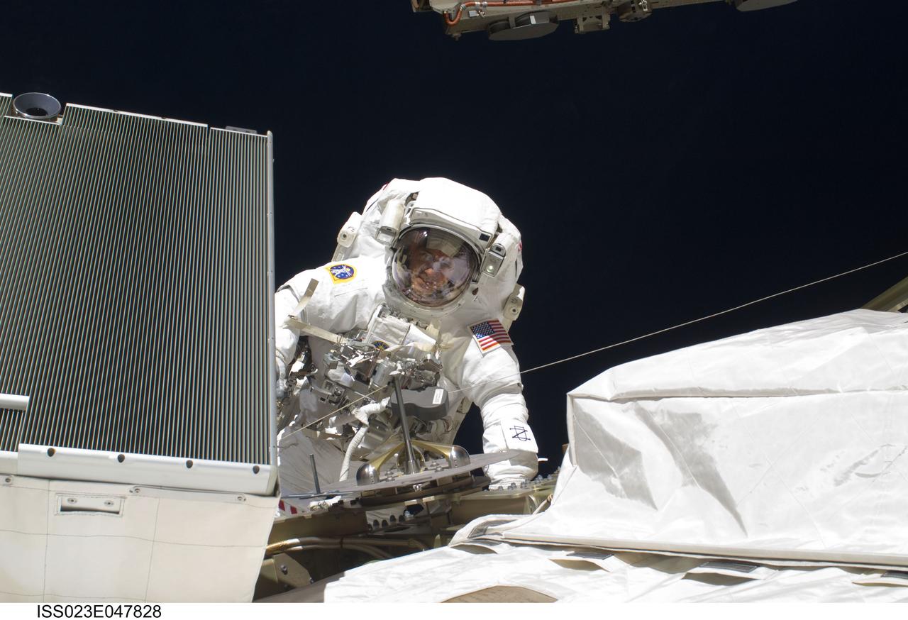 ISS023-E-047828 (21 May 2010) --- NASA astronaut Michael Good, STS-132 mission specialist, participates in the mission?s third and final session of extravehicular activity (EVA) as construction and maintenance continue on the International Space Station. During the six-hour, 46-minute spacewalk, Good and NASA astronaut Garrett Reisman (out of frame), mission specialist, completed the installation of the final two of the six new batteries for the B side of the port 6 solar array. In addition, the astronauts installed a backup ammonia jumper cable between the port 4 and 5 trusses of the station, transferred a Power and Data Grapple Fixture from the shuttle to the station, and reconfigured some tools.