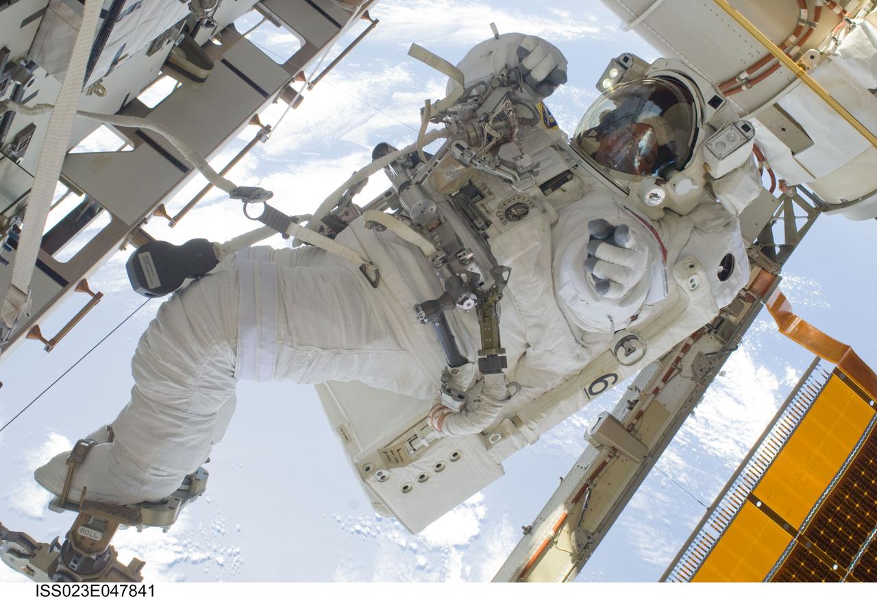 ISS023-E-047841 (21 May 2010) --- NASA astronaut Garrett Reisman, STS-132 mission specialist, participates in the mission?s third and final session of extravehicular activity (EVA) as construction and maintenance continue on the International Space Station. During the six-hour, 46-minute spacewalk, Reisman and NASA astronaut Michael Good (out of frame), mission specialist, completed the installation of the final two of the six new batteries for the B side of the port 6 solar array. In addition, the astronauts installed a backup ammonia jumper cable between the port 4 and 5 trusses of the station, transferred a Power and Data Grapple Fixture from the shuttle to the station, and reconfigured some tools.