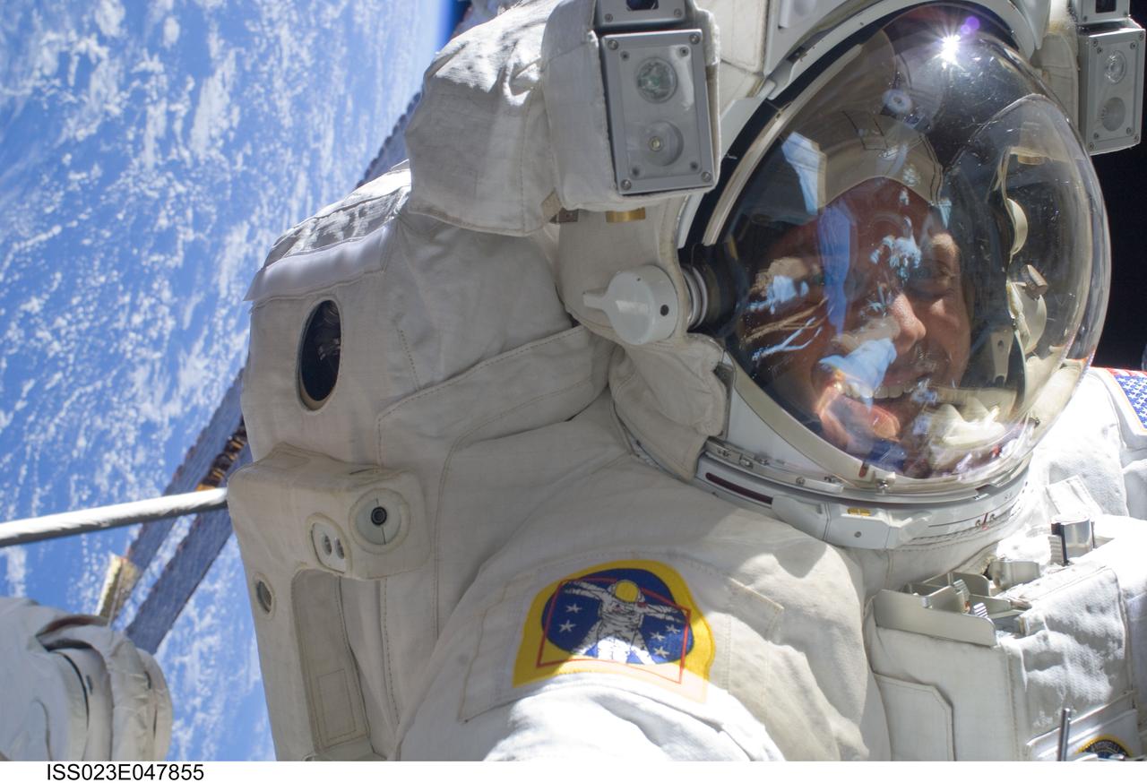 ISS023-E-047855 (21 May 2010) --- NASA astronaut Garrett Reisman, STS-132 mission specialist, participates in the mission?s third and final session of extravehicular activity (EVA) as construction and maintenance continue on the International Space Station. During the six-hour, 46-minute spacewalk, Reisman and NASA astronaut Michael Good (out of frame), mission specialist, completed the installation of the final two of the six new batteries for the B side of the port 6 solar array. In addition, the astronauts installed a backup ammonia jumper cable between the port 4 and 5 trusses of the station, transferred a Power and Data Grapple Fixture from the shuttle to the station, and reconfigured some tools.