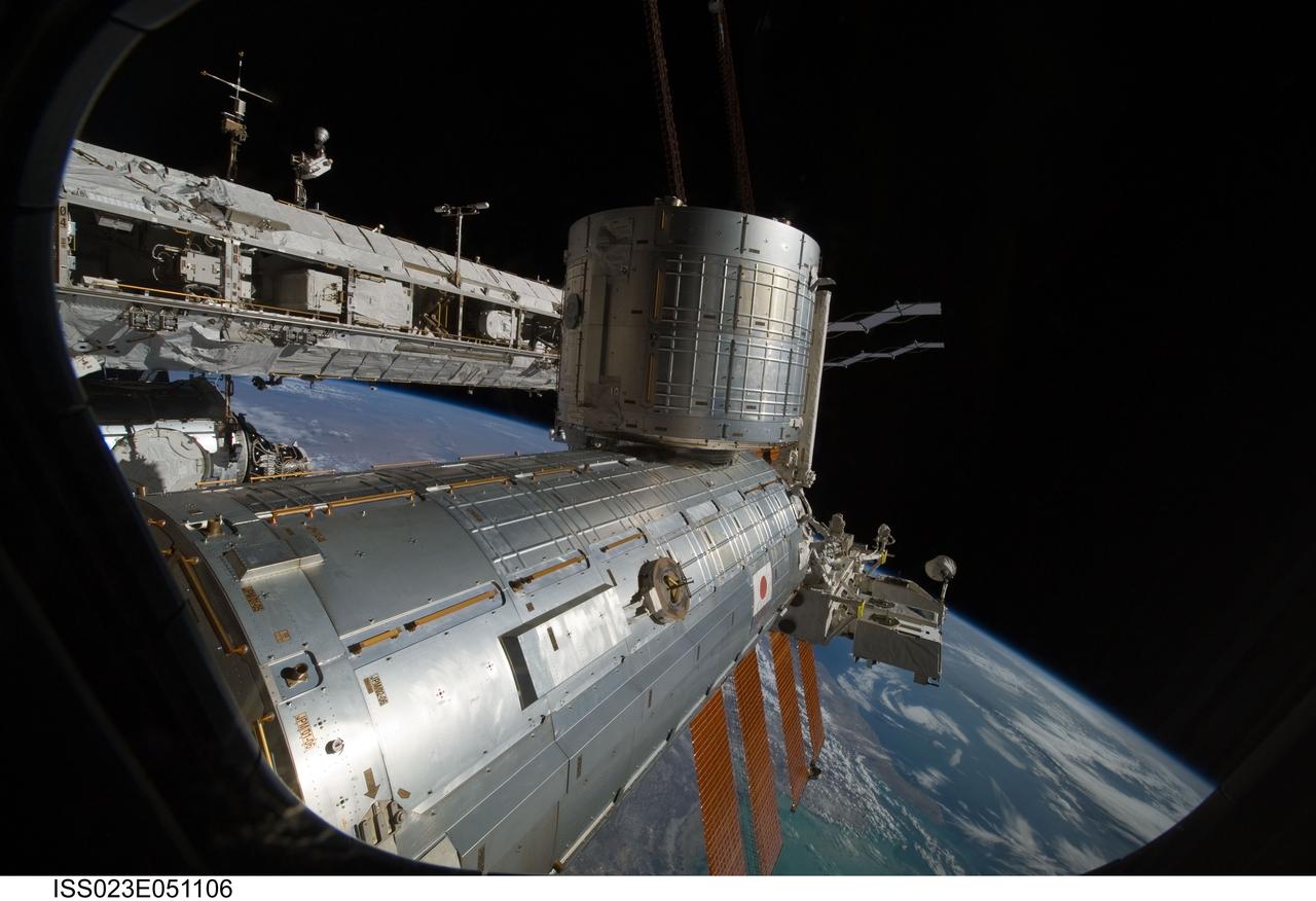 ISS023-E-051106 (23 May 2010) --- Backdropped by Earth's horizon and the blackness of space, the Japanese Kibo complex of the International Space Station is featured in this image photographed by an Expedition 23 crew member while space shuttle Atlantis (STS-132) remains docked with the station.