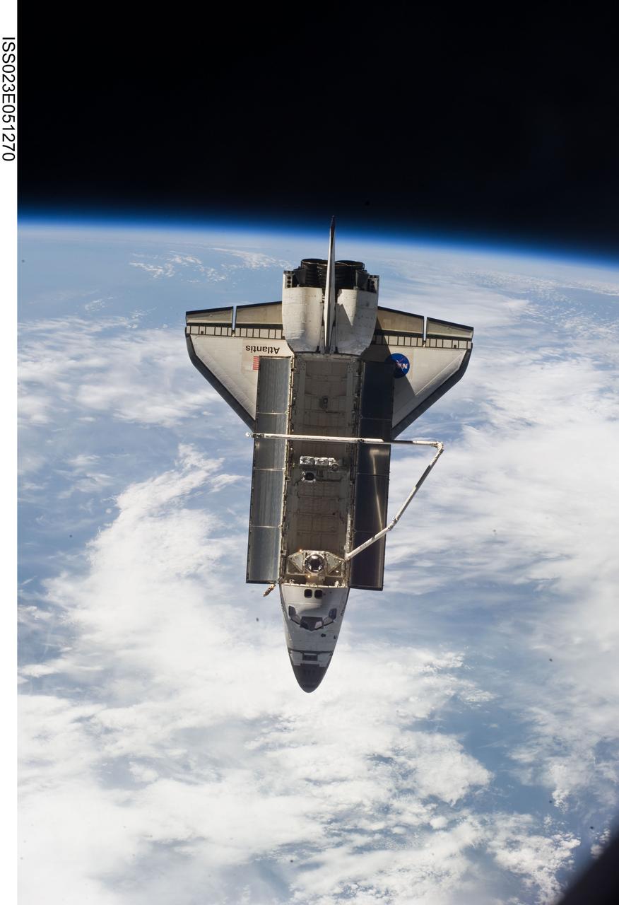 ISS023-E-051270 (23 May 2010) --- Space shuttle Atlantis is featured in this image photographed by an Expedition 23 crew member on the International Space Station soon after the shuttle and station began their post-undocking relative separation. Undocking of the two spacecraft occurred at 10:22 a.m. (CDT) on May 23, 2010, ending a seven-day stay that saw the addition of a new station module, replacement of batteries and resupply of the orbiting outpost. Earth?s horizon and the blackness of space provide the backdrop for the scene.
