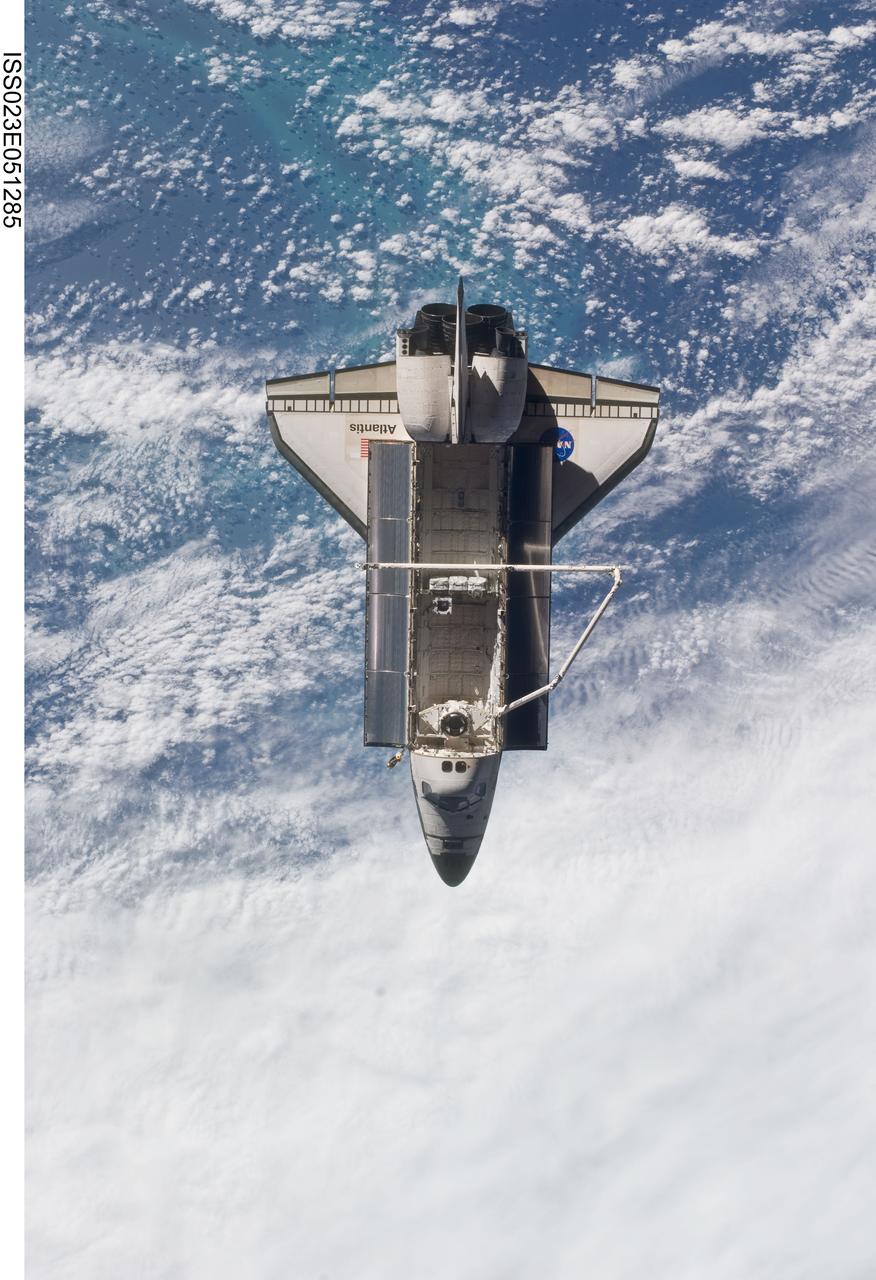 ISS023-E-051285 (23 May 2010) --- Space shuttle Atlantis is featured in this image photographed by an Expedition 23 crew member on the International Space Station soon after the shuttle and station began their post-undocking relative separation. Undocking of the two spacecraft occurred at 10:22 a.m. (CDT) on May 23, 2010, ending a seven-day stay that saw the addition of a new station module, replacement of batteries and resupply of the orbiting outpost. A blue and white part of Earth provides the backdrop for the scene.