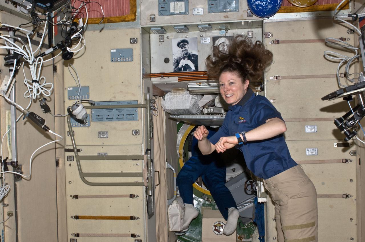 ISS024-E-006182 (17 June 2010) --- NASA astronaut Tracy Caldwell Dyson, Expedition 24 flight engineer, is pictured in the Zvezda Service Module of the International Space Station.