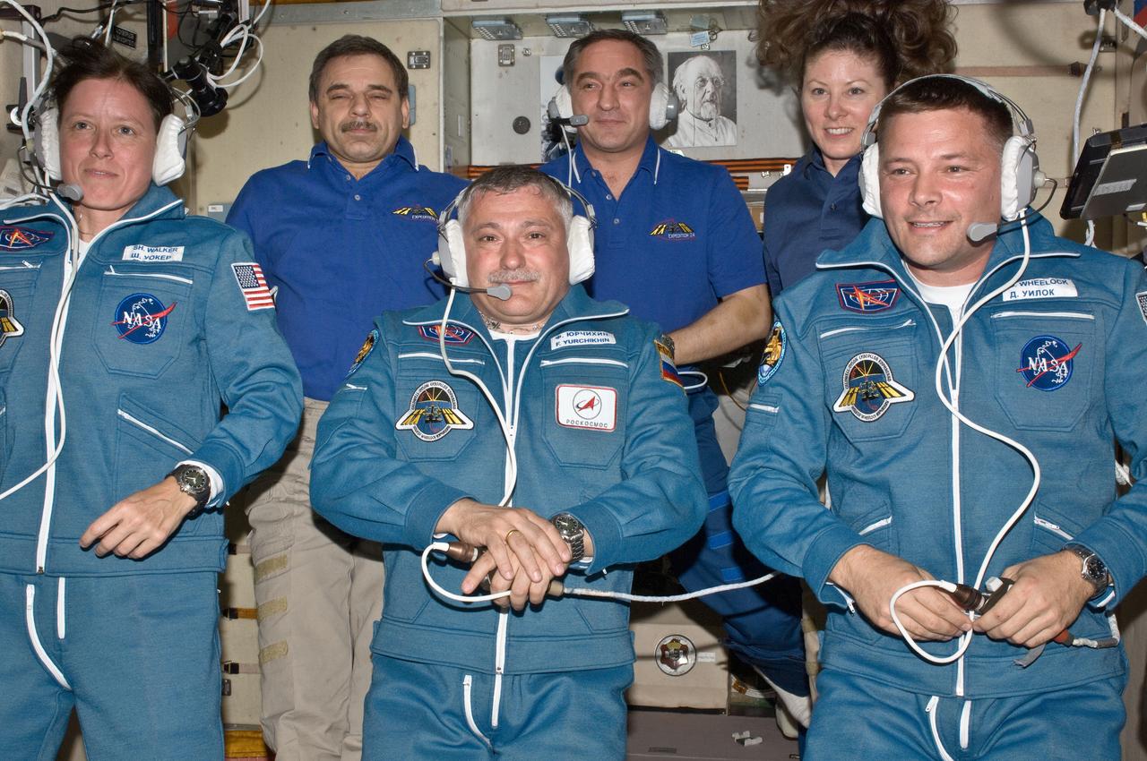 ISS024-E-006213 (17 June 2010) --- Expedition 24 crew members pose for a photo in the Zvezda Service Module of the International Space Station. Pictured on the front row are Russian cosmonaut Fyodor Yurchikhin (center); along with NASA astronauts Shannon Walker and Doug Wheelock, all flight engineers. Pictured on the back row are Russian cosmonaut Alexander Skvortsov (center), commander; along with NASA astronaut Tracy Caldwell Dyson and Russian cosmonaut Mikhail Kornienko, both flight engineers. The event happened shortly after Wheelock, Walker and Yurchikhin arrived in the Soyuz TMA-19 spacecraft.
