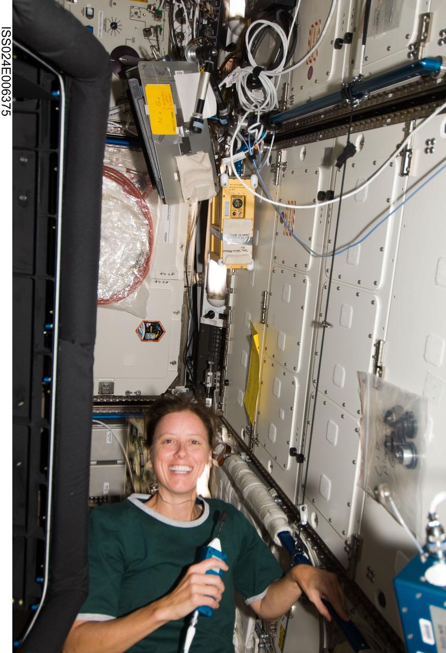ISS024-E-006375 (22 June 2010) --- NASA astronaut Shannon Walker, Expedition 24 flight engineer, uses a communication system while working in the Destiny laboratory of the International Space Station.