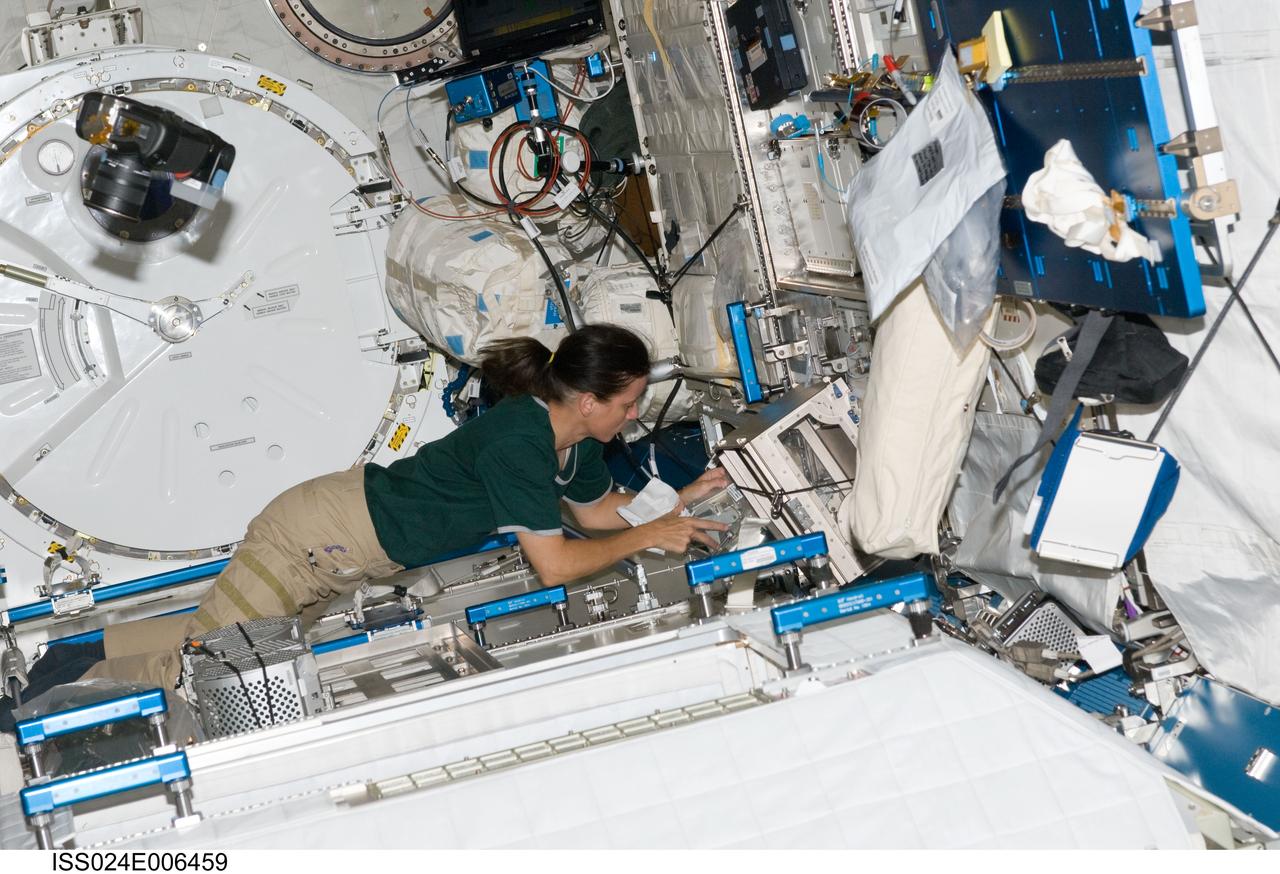 ISS024-E-006459 (24 June 2010) --- NASA astronaut Shannon Walker, Expedition 24 flight engineer, works in the Kibo laboratory of the International Space Station.