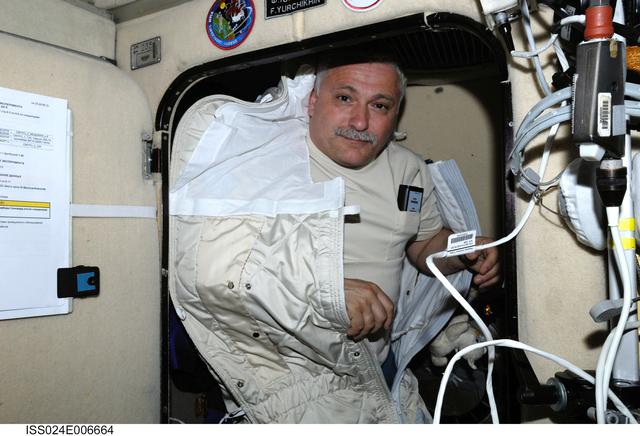 NASA image: FE Yurchikhin poses for a photo with SonoCard