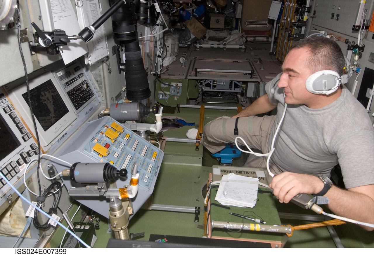 ISS024-E-007399 (4 July 2010) --- Russian cosmonaut Alexander Skvortsov, Expedition 24 commander, monitors data at the manual TORU docking system controls in the Zvezda Service Module of the International Space Station during the approach of the ISS Progress 38 supply vehicle bringing almost two tons of food, fuel, oxygen, propellant and supplies for the Expedition 24 crew members aboard the station. After an aborted docking on July 2, Progress 38 successfully docked to the aft end of the Zvezda Service Module at 12:17 p.m. (EDT) on July 4, 2010. The docking was executed flawlessly by Progress’ Kurs automated rendezvous system.